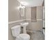 Compact bathroom with pedestal sink, classic fixtures, and unique stone flooring at 1618 Mason Mill Ne Rd, Atlanta, GA 30329