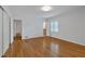 Light-filled bedroom featuring hardwood floors and access to an en-suite bathroom at 1618 Mason Mill Ne Rd, Atlanta, GA 30329