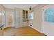 Bright dining area with built-in cabinets and drawers, hardwood floor, and a charming vintage light fixture at 1618 Mason Mill Ne Rd, Atlanta, GA 30329
