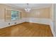 Dining room featuring hardwood flooring, a stylish chandelier, and a large window for natural light at 1618 Mason Mill Ne Rd, Atlanta, GA 30329
