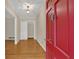 Home's entry showcasing hardwood floors and a striking red front door at 1618 Mason Mill Ne Rd, Atlanta, GA 30329