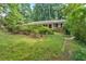 Charming traditional single-story brick home nestled among mature trees and greenery at 1618 Mason Mill Ne Rd, Atlanta, GA 30329