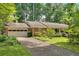 Charming brick ranch home with a two-car garage and lush landscaping at 1618 Mason Mill Ne Rd, Atlanta, GA 30329