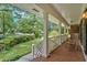 Inviting front porch features rocking chairs and beautiful views of the yard at 1618 Mason Mill Ne Rd, Atlanta, GA 30329
