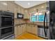 Kitchen area with stainless steel appliances, a large sink, and neutral-colored cabinetry at 1618 Mason Mill Ne Rd, Atlanta, GA 30329