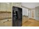 Kitchen area featuring stainless steel appliances, built-in cabinetry, and a spacious refrigerator at 1618 Mason Mill Ne Rd, Atlanta, GA 30329
