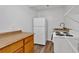 Kitchenette with compact appliances, wood cabinets, and stainless steel sink at 1618 Mason Mill Ne Rd, Atlanta, GA 30329