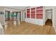 Open-concept living room with bright light, hardwood flooring, and built-in shelving with decorative accents at 1618 Mason Mill Ne Rd, Atlanta, GA 30329