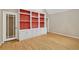 Charming living room featuring hardwood floors and built-in shelving units with decorative accents at 1618 Mason Mill Ne Rd, Atlanta, GA 30329