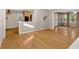 Bright open-concept living room with hardwood flooring and access to the kitchen and outdoor patio at 1618 Mason Mill Ne Rd, Atlanta, GA 30329