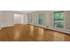 Bright living room features hardwood flooring and lots of natural light from the three large windows at 1618 Mason Mill Ne Rd, Atlanta, GA 30329
