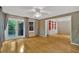 Spacious living room featuring hardwood floors, backyard access, brick siding, and built-in shelving at 1618 Mason Mill Ne Rd, Atlanta, GA 30329