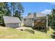 Home with a spacious backyard, deck, and a separate building, offering ample outdoor space at 40 Browning Dr, Covington, GA 30016