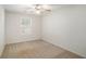 Bright bedroom with a window and ceiling fan providing natural light and air circulation at 40 Browning Dr, Covington, GA 30016