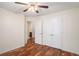 Bedroom with hardwood floors features a double door closet and a hallway view at 40 Browning Dr, Covington, GA 30016