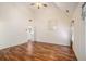 Spacious bedroom featuring hardwood floors, vaulted ceilings, a window and entry to ensuite bathroom at 40 Browning Dr, Covington, GA 30016