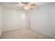 Cozy bedroom featuring a ceiling fan and an open doorway, enhancing the room's accessibility at 40 Browning Dr, Covington, GA 30016