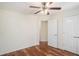 Bedroom with hardwood floors features a double door closet and a hallway view at 40 Browning Dr, Covington, GA 30016