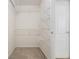 Walk-in closet featuring wire shelving and light carpet at 40 Browning Dr, Covington, GA 30016