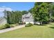 Inviting home featuring a well-maintained lawn and mature trees at 40 Browning Dr, Covington, GA 30016
