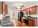 Cozy kitchen featuring wood cabinets, stainless steel appliances, and hardwood flooring at 40 Browning Dr, Covington, GA 30016