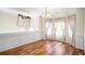 Elegant living room boasting hardwood floors, natural light, and wainscoting at 40 Browning Dr, Covington, GA 30016