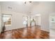 Sun-filled living room featuring vaulted ceilings, hardwood floors and 3 windows at 40 Browning Dr, Covington, GA 30016