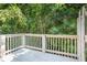 Backyard deck overlooking mature trees at 406 Heritage Park Nw Trce # 22, Kennesaw, GA 30144