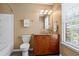 Bathroom with a vanity, granite countertop, and updated fixtures at 406 Heritage Park Nw Trce # 22, Kennesaw, GA 30144