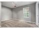 Empty bedroom with neutral walls, carpet, and a window providing natural light at 406 Heritage Park Nw Trce # 22, Kennesaw, GA 30144