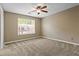 Bedroom with neutral walls and carpet, a ceiling fan, and bright natural light at 406 Heritage Park Nw Trce # 22, Kennesaw, GA 30144