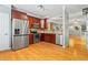 Modern kitchen boasts stainless steel appliances, tile backsplash, and hardwood floors at 406 Heritage Park Nw Trce # 22, Kennesaw, GA 30144