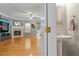 Open living room with hardwood floors, fireplace, and half bath at 406 Heritage Park Nw Trce # 22, Kennesaw, GA 30144