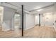 Finished basement area with modern flooring, open layout, and visible support beams at 1328 Eason Nw St, Atlanta, GA 30314