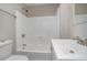 Bathroom featuring a tub, toilet, and modern sink, offering clean and functional space at 1328 Eason Nw St, Atlanta, GA 30314