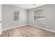 Bright bedroom with wood floors, two windows, and neutral walls, offering a cozy and inviting atmosphere at 1328 Eason Nw St, Atlanta, GA 30314