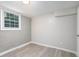 Cozy room with wood floors, a window, a door, and fresh paint, providing a comfortable living space at 1328 Eason Nw St, Atlanta, GA 30314