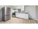 Bright kitchen with stainless steel appliances, granite countertops, and white cabinets, providing a modern cooking space at 1328 Eason Nw St, Atlanta, GA 30314