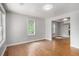 Bright living room with hardwood floors, neutral walls, and natural light from a window at 1328 Eason Nw St, Atlanta, GA 30314