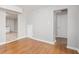 Cozy room featuring hardwood floors, neutral walls, and doorways to other spaces at 1328 Eason Nw St, Atlanta, GA 30314