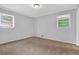 Bright bedroom featuring neutral walls and plush carpeting at 1724 Rhonda Ln, Stone Mountain, GA 30087