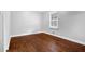 Bedroom with hardwood floors and natural light from a window at 1724 Rhonda Ln, Stone Mountain, GA 30087