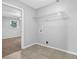 Functional laundry area with tile flooring and washer hookups at 1724 Rhonda Ln, Stone Mountain, GA 30087