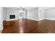 Inviting living room boasts hardwood floors, a white brick fireplace, and an open layout at 1724 Rhonda Ln, Stone Mountain, GA 30087