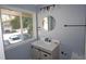 This bathroom has a round mirror, marble sink top, and updated vanity at 346 Carpenter Drive Northeast Dr # 32, Sandy Springs, GA 30328