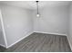 Inviting dining area with stylish gray floors, neutral walls, and modern lighting fixture at 346 Carpenter Drive Northeast Dr # 32, Sandy Springs, GA 30328