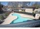 A refreshing outdoor swimming pool surrounded by a concrete deck and partial fence at 346 Carpenter Drive Northeast Dr # 32, Sandy Springs, GA 30328