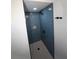 This custom shower features a shower niche, blue tile, and rainfall shower head at 346 Carpenter Drive Northeast Dr # 32, Sandy Springs, GA 30328