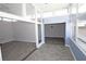 Bright sunroom featuring floor-to-ceiling windows, gray wood floors, and modern ceiling fans at 346 Carpenter Drive Northeast Dr # 32, Sandy Springs, GA 30328