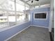 Bright sunroom featuring floor-to-ceiling windows, gray wood floors, and modern ceiling fan at 346 Carpenter Drive Northeast Dr # 32, Sandy Springs, GA 30328